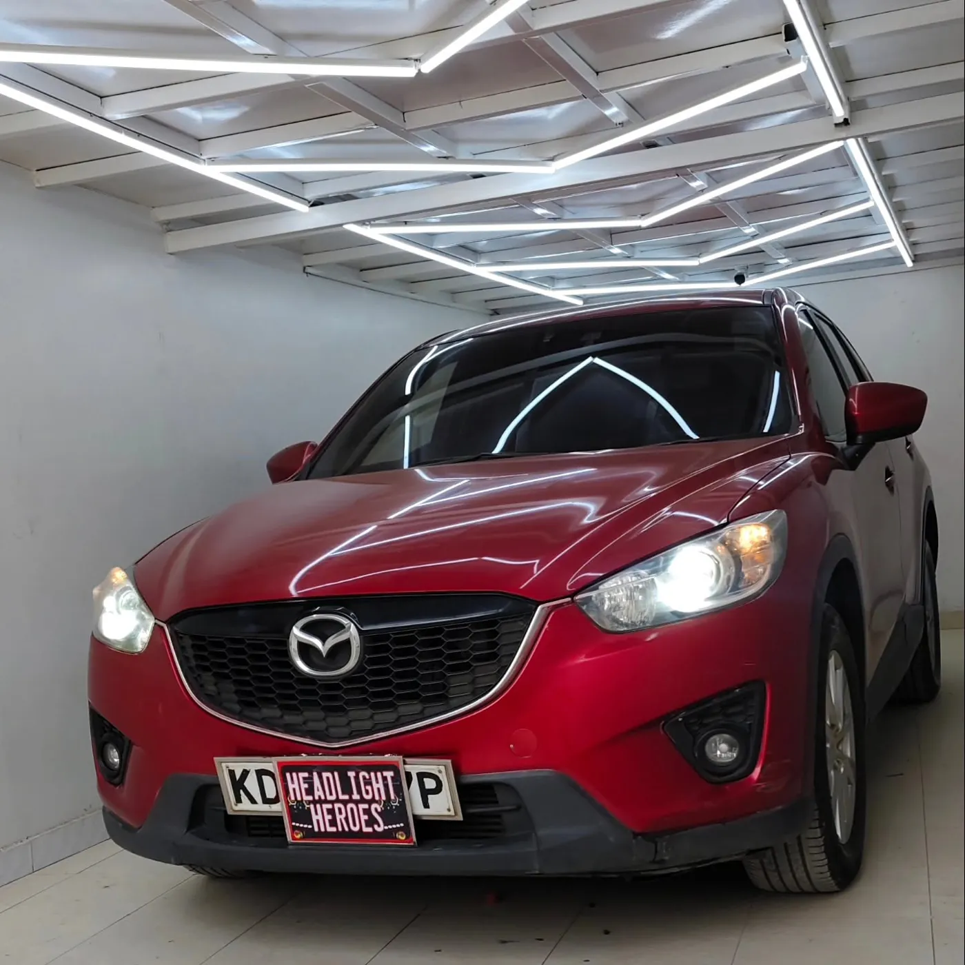 Mazda CX-5 from the side with headlights on