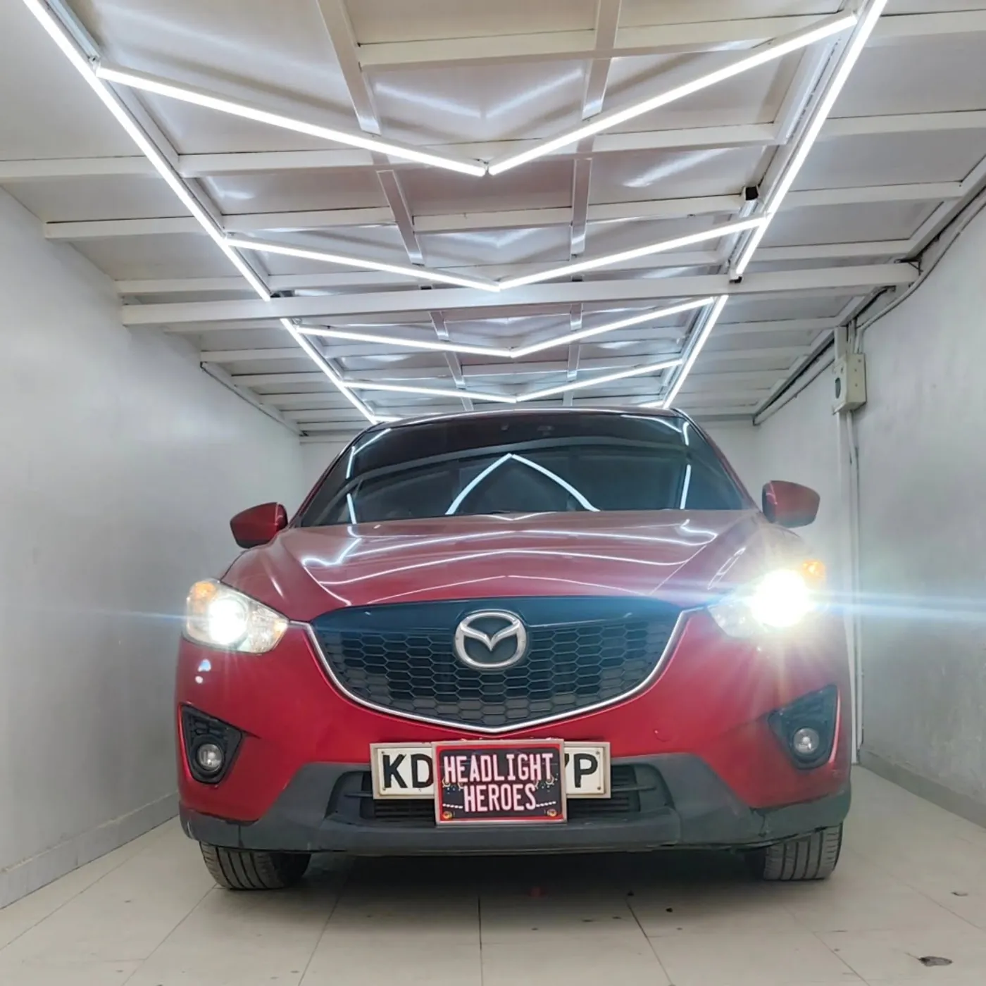 Mazda CX-5 in the bay with headlights on