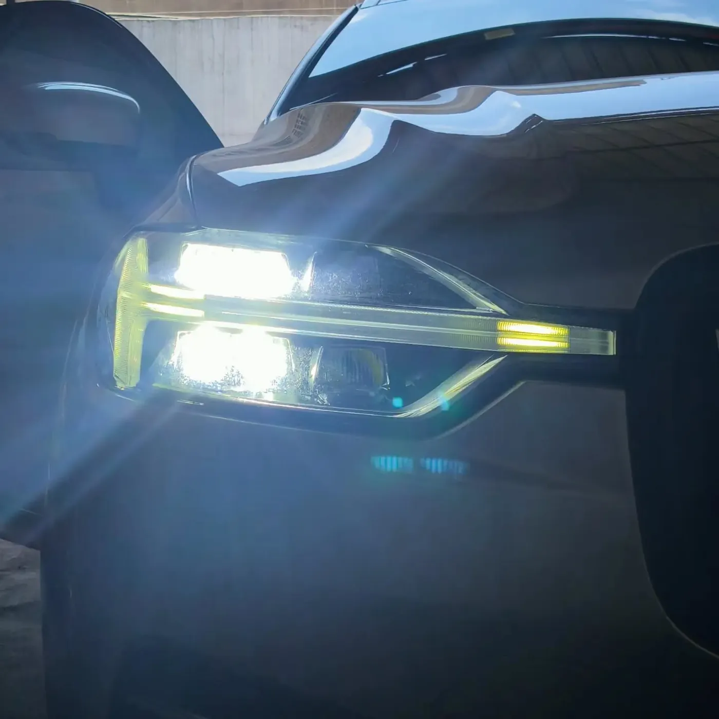 LED headlight lit at dusk