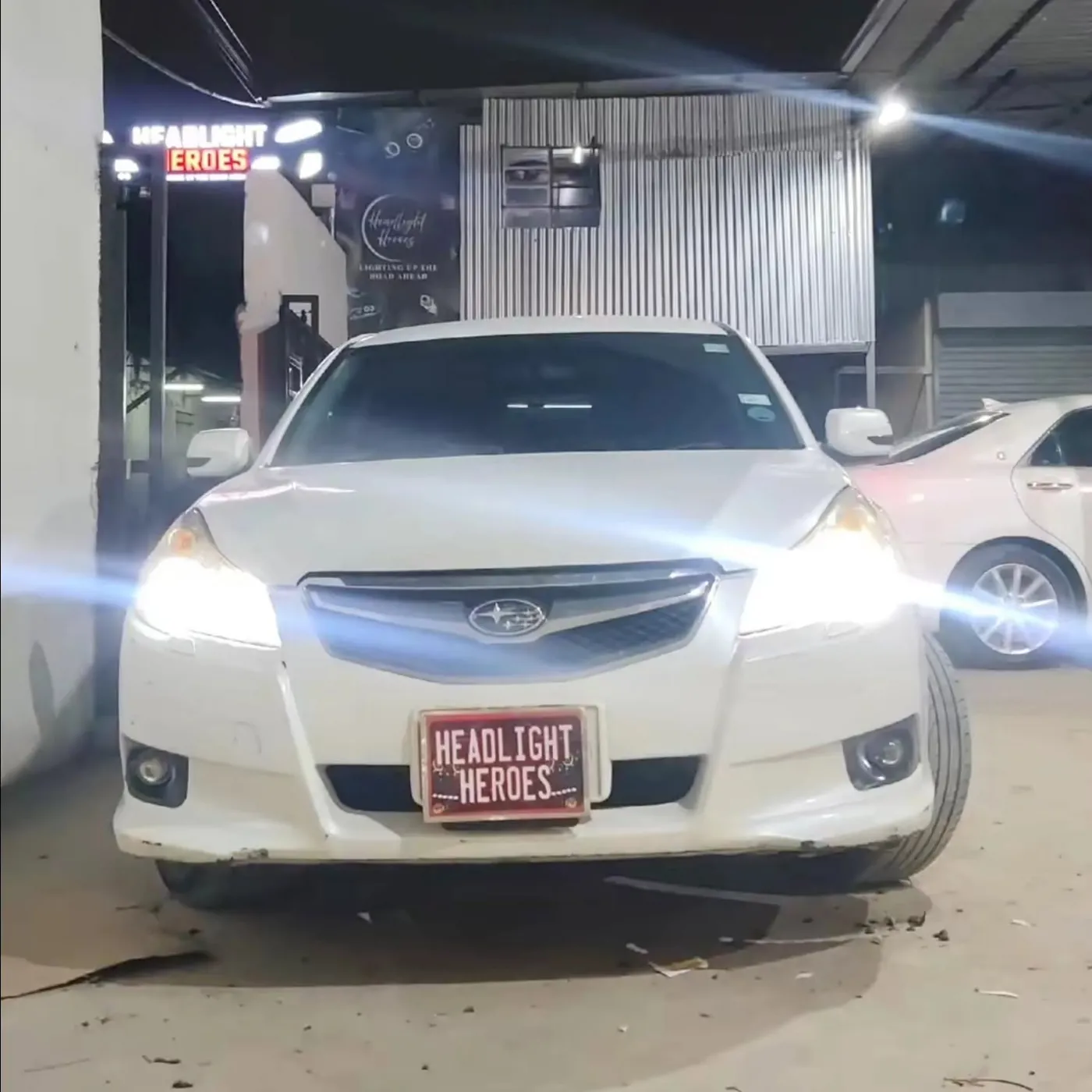 Subaru Legacy with projector headlights on