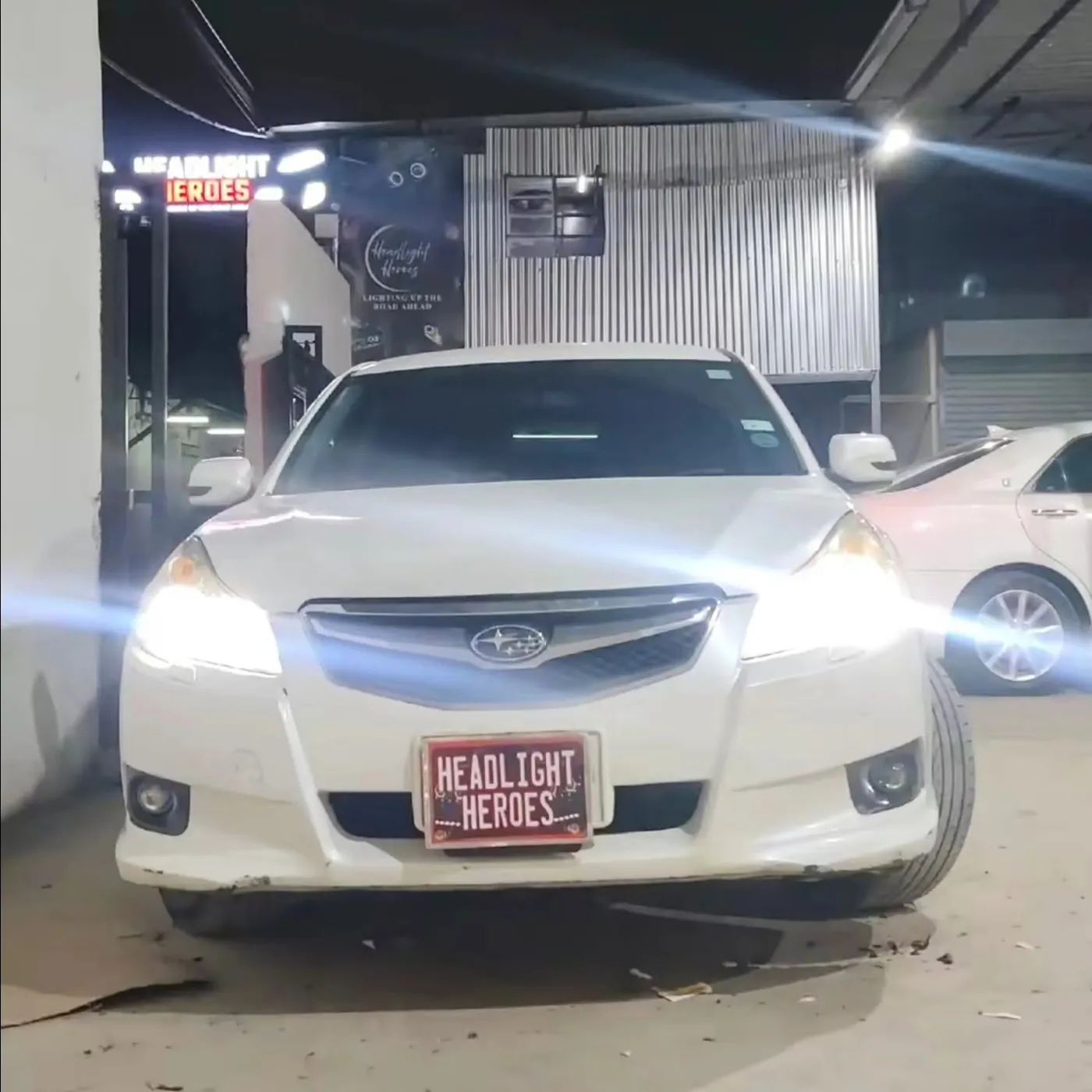 The same Subaru Legacy with upgraded projector headlights on