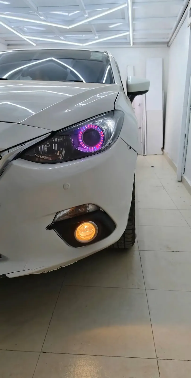 Mazda headlight with purple ring