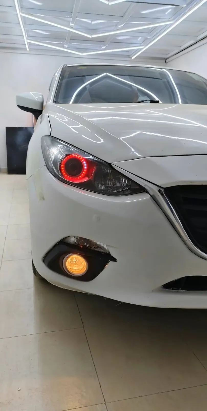 Mazda headlight with a red angel ring