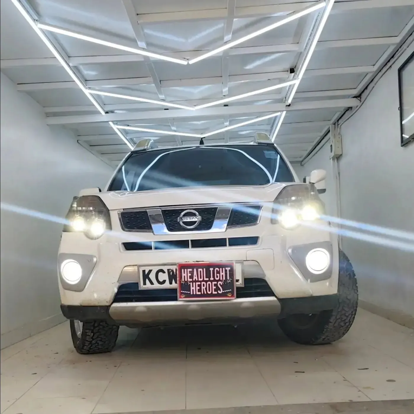 Nissan X-Trail with headlights and fog lights on